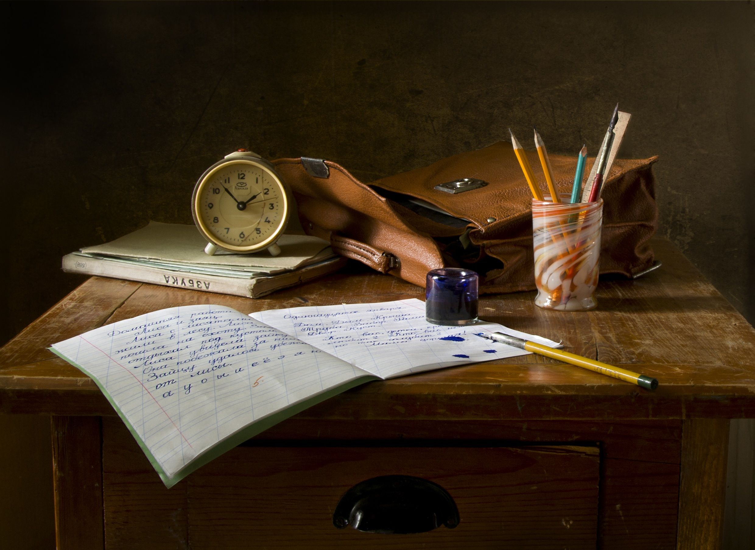 notes and study essentials on a warm wooden desk